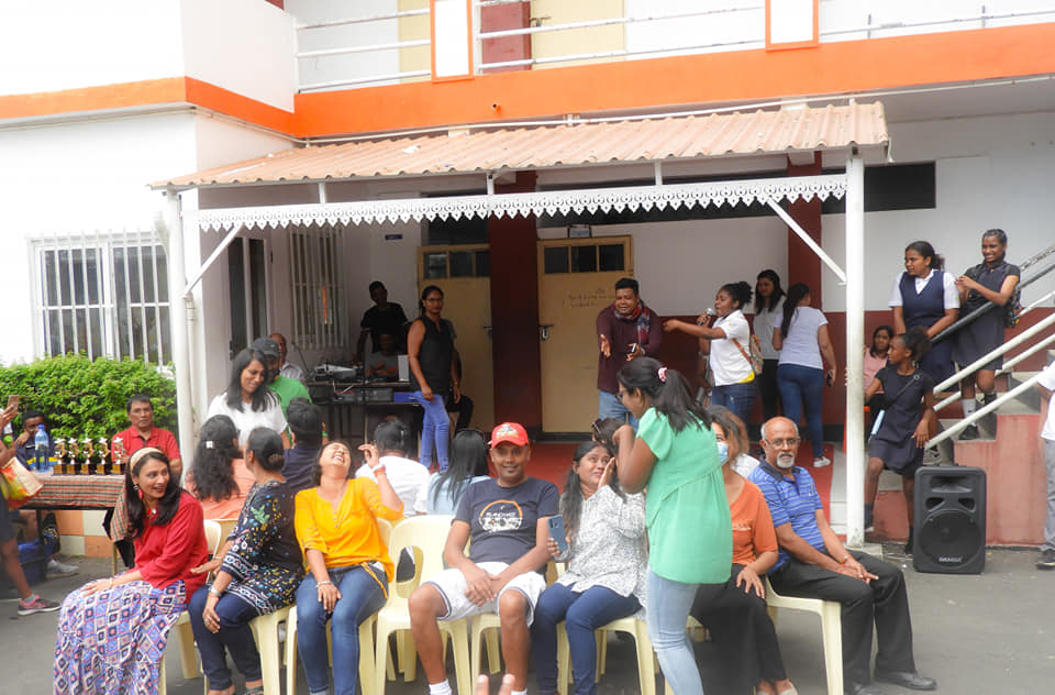 School staff and pupils outside on an activity day